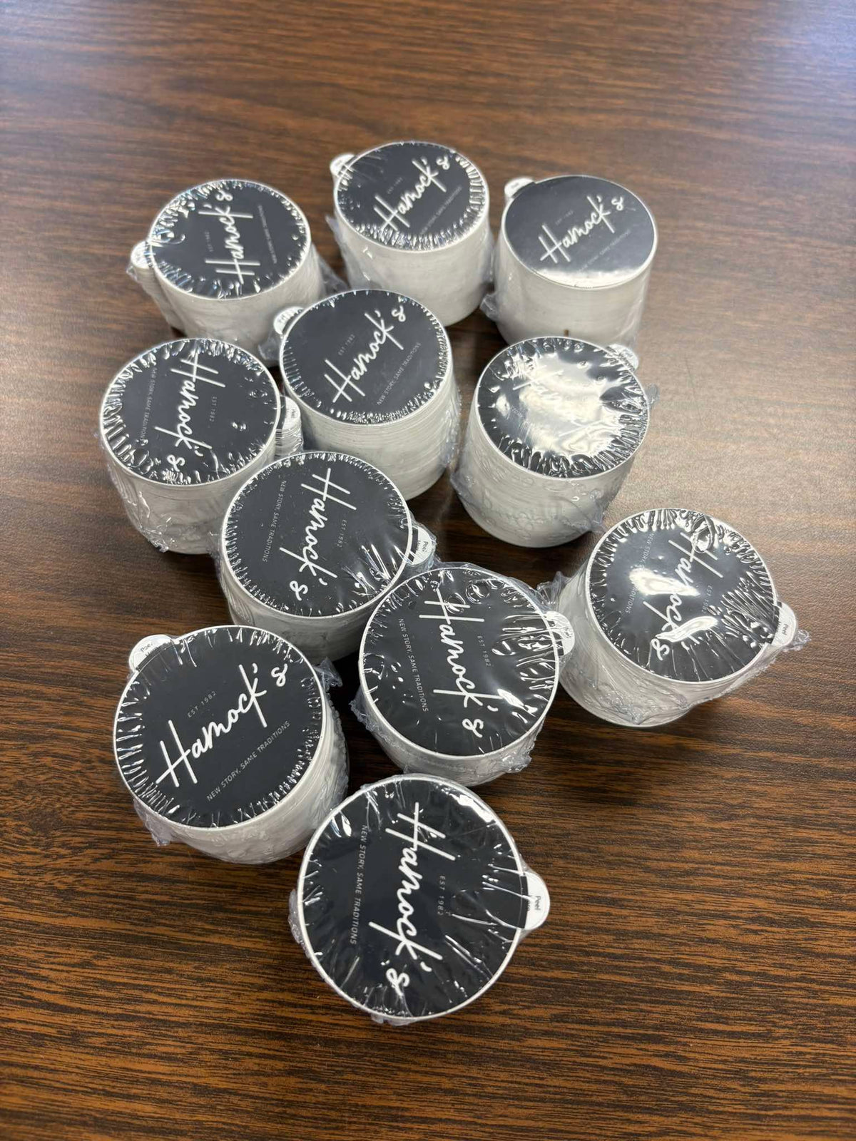Stacks of custom printed stickers for Hamock's, established 1982, by United Branding Supply